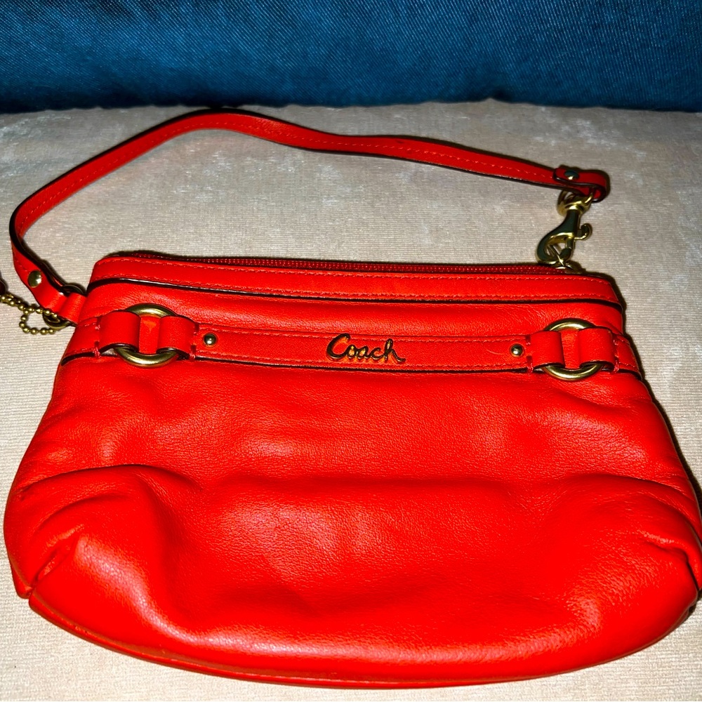 **PRICE DROPPED for Mothers Day** Coach Orange Leather wristlet GUC